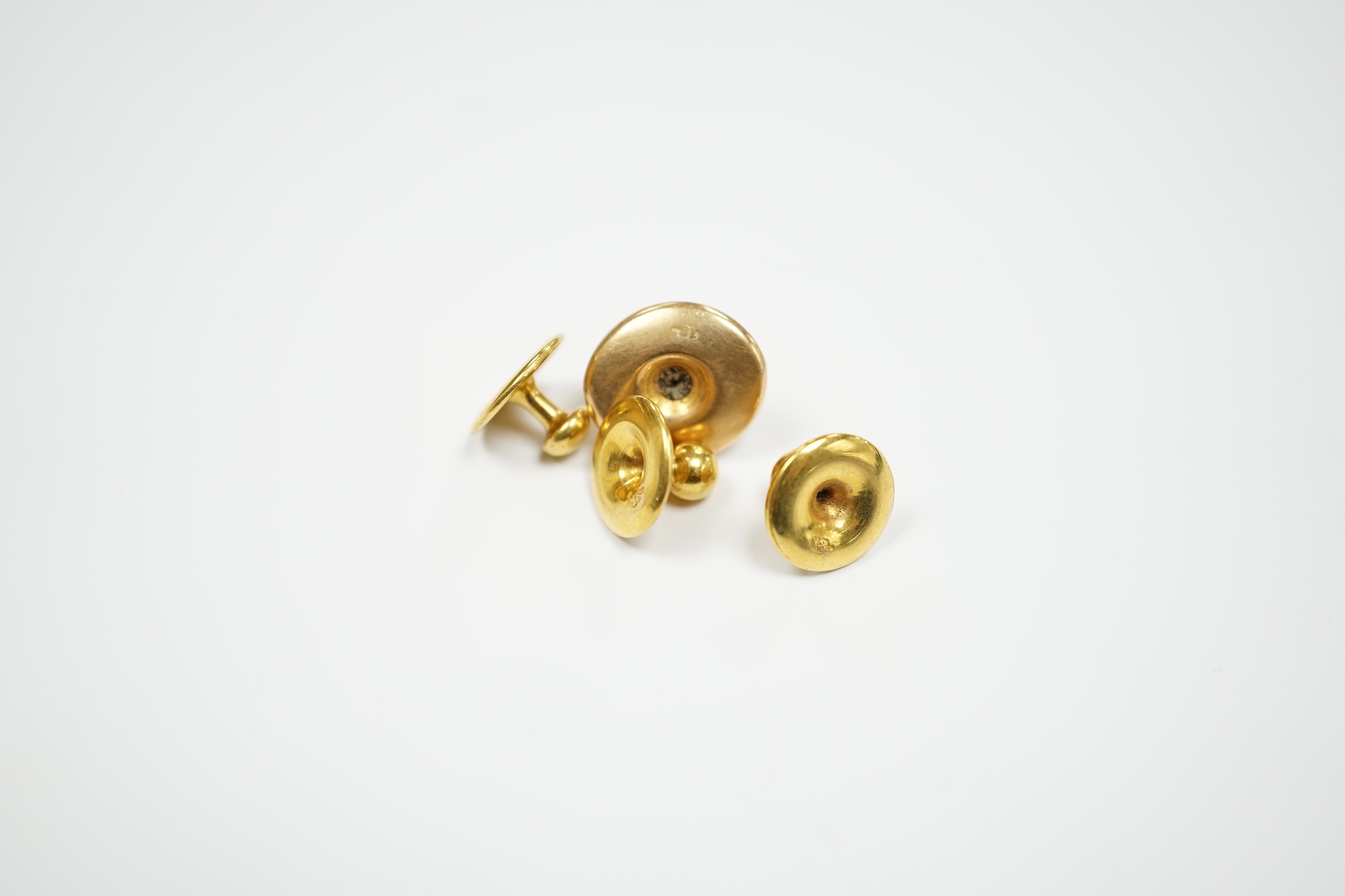 Four 18ct dress studs, 3.3 grams.